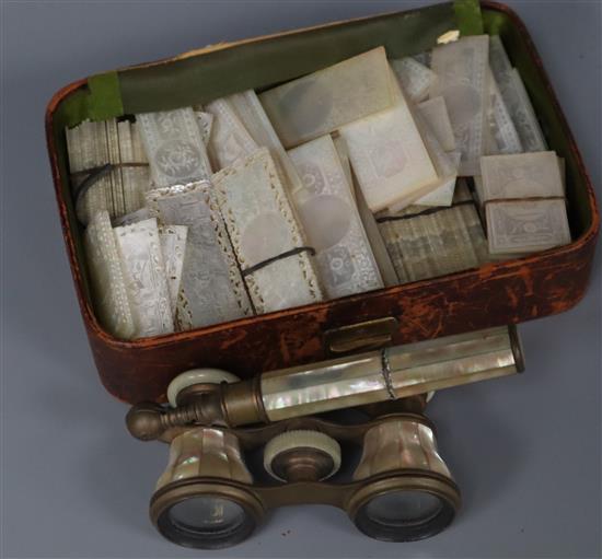 A quantity of Victorian mother of pearl gaming counters and a pair of opera glasses